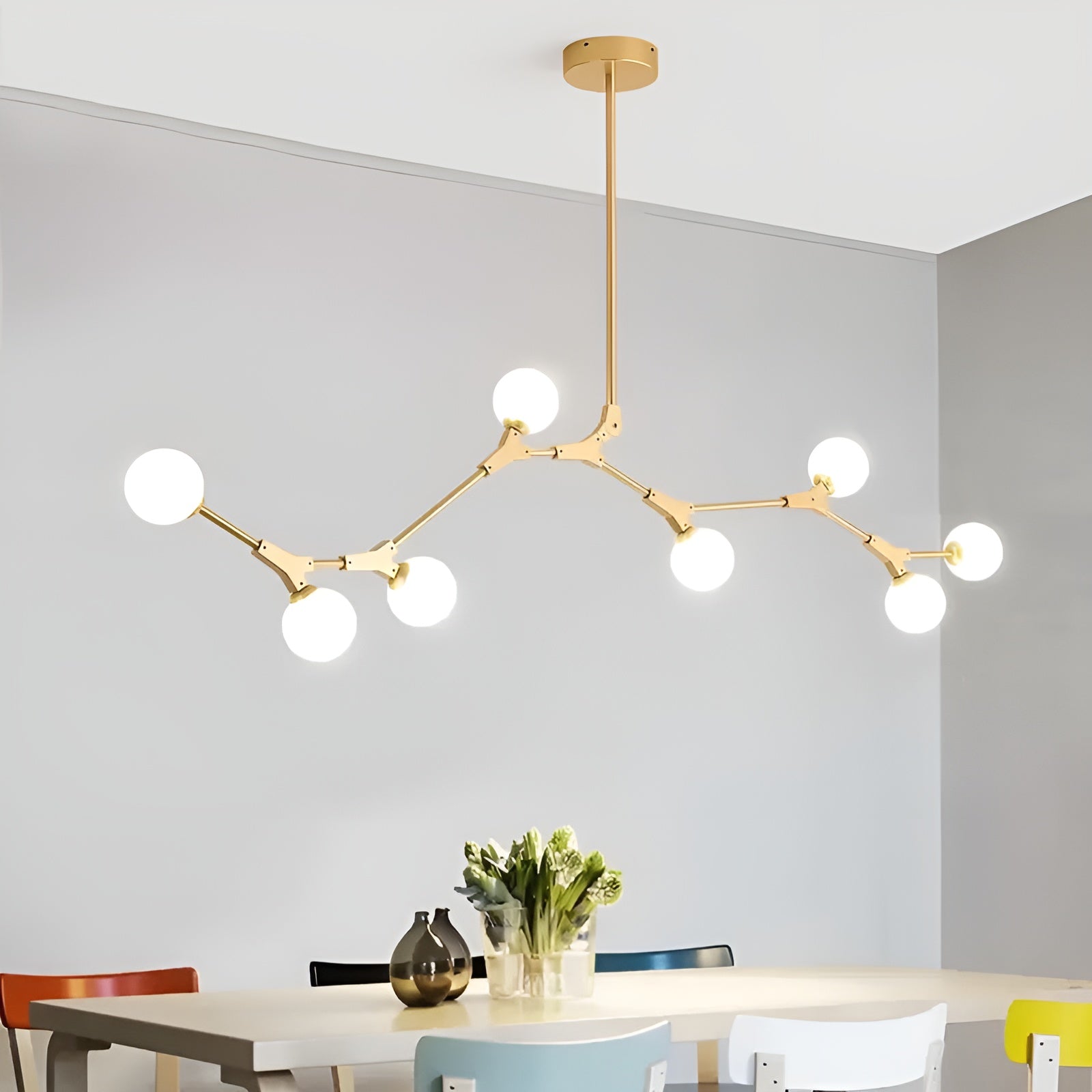 LustraSphere – 8-Light Brass Globe Chandelier for Modern Spaces